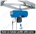 Hoist on tubular profile with curve