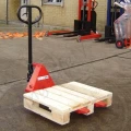 Mini Pallet Truck Lifting a Pallet